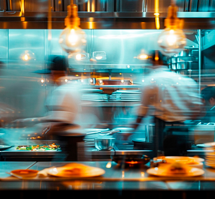 Chefs moving in a kitchen. 